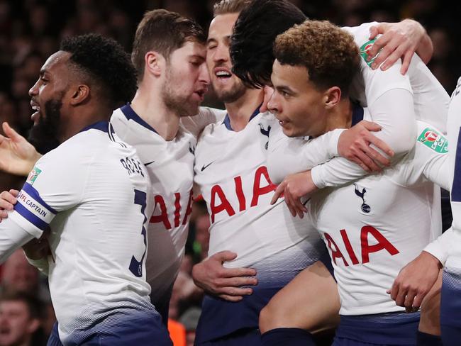 LONDON, ENGLAND - DECEMBER 19:  Dele Alli of Tottenham Hotspur celebrates with teammates after scoring his team's second goal during the Carabao Cup Quarter Final match between Arsenal and Tottenham Hotspur at Emirates Stadium on December 19, 2018 in London, United Kingdom.  (Photo by Alex Morton/Getty Images)