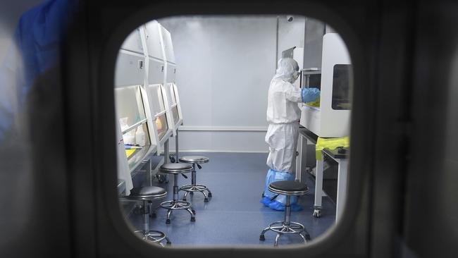 A laboratory technician works in Wuhan. Picture: AFP