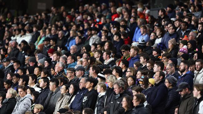 Fans observe a minute of silence for victims of the shooting in Auckland ahead of the match between New Zealand and Norway at Eden Park. Picture: AFP.