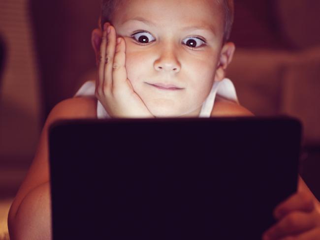 Generic image of a child looking at a tablet or iPad. Photo from iStock.