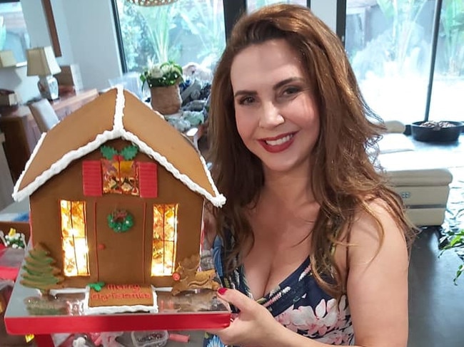 Stonnington mayor Melina Sehr with one of her gingerbead houses. Picture: Facebook