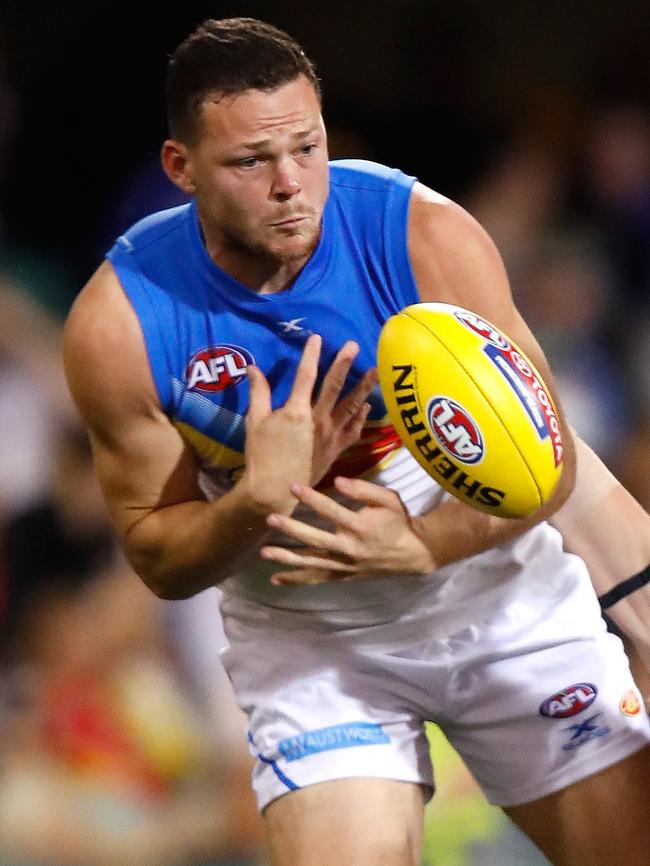 Steven May in action for Gold Coast against Brisbane.