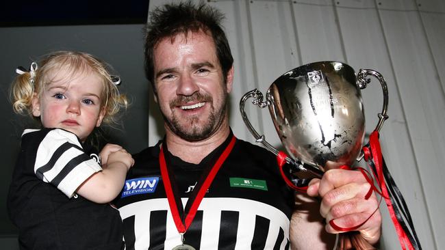 Crows legend Mark Ricciuto with daughter Sophie in 2008.