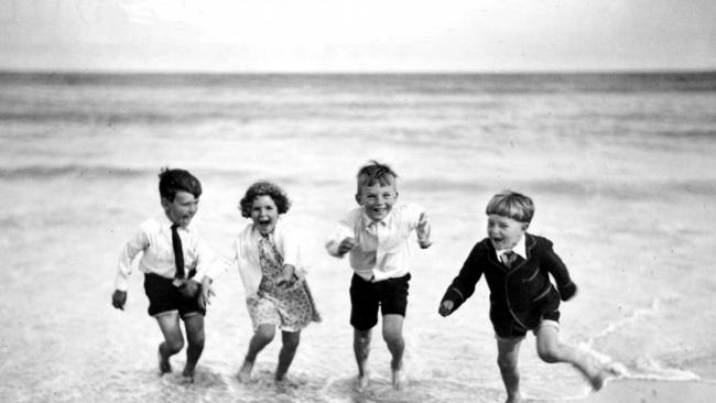 Photo of children "Frolicking In The Surf" on Bondi Beach, by Sam Hood, taken in 1932. General Historical New South Wales (NSW) / Beaches People / Children Photography