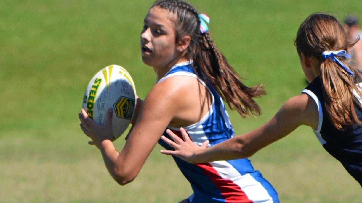 FAST MOVER: Darling Downs touch footballer Georgia Bartlett attempts to evade her opponent during a match at the Queensland School Sport Touch Football State Championships. Picture: Contributed