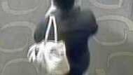 Security footage of Shandee Blackburn leaving her work with her handbag minutes before she was stabbed to death. The bag has never been found.