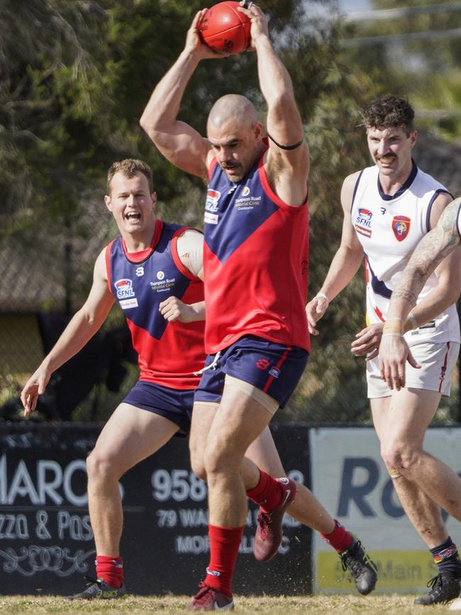 SFL: Chelsea Heights’ Luke Clark claims the mark. Picture: Valeriu Campan