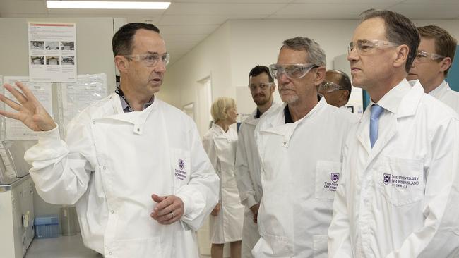 Professor Trent Munro, with Professor Paul Young, talks the federal Health Minister Greg Hunt through the work on the University of Queensland’s first Covid-19 vaccine. Picture: NewsWire.