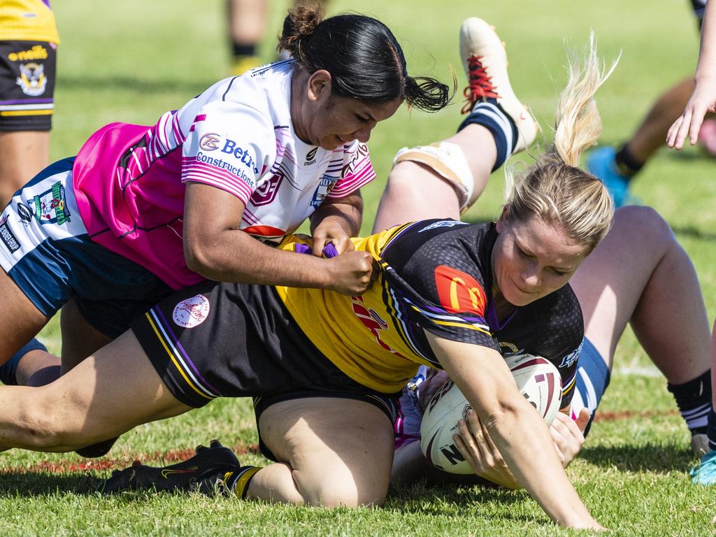 Sarah Hoger of Gatton is tackled by Brothers players. Picture: Kevin Farmer