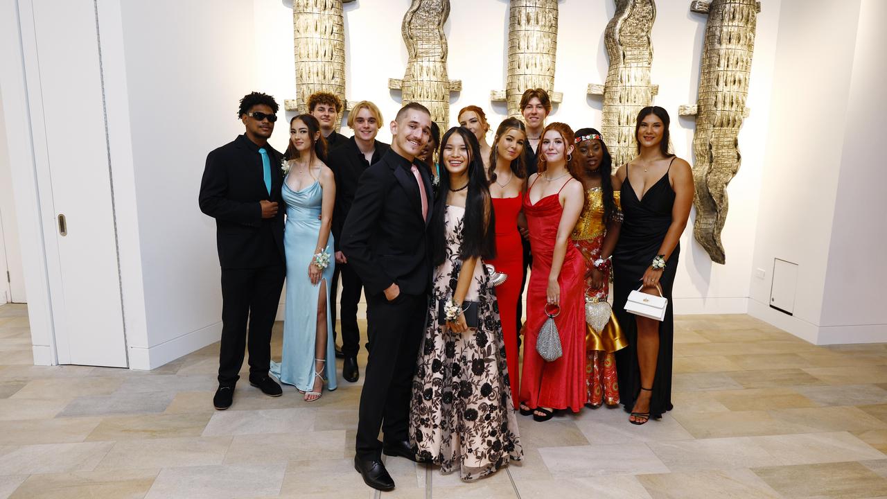 Melody Neal and her date Hunter Smith celebrate the end of Grade 12 with friends at the Peace Lutheran College formal evening at the Cairns Convention Centre. Ms Neal was the victim of a stabbing at the school on May 16, which damaged her liver and severed nerves in her spine. Picture: Brendan Radke