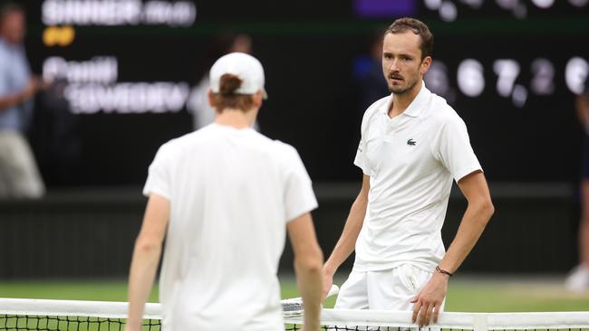 Daniil Medvedev greets a weary Jannik Sinner at the net. Picture: Getty Images