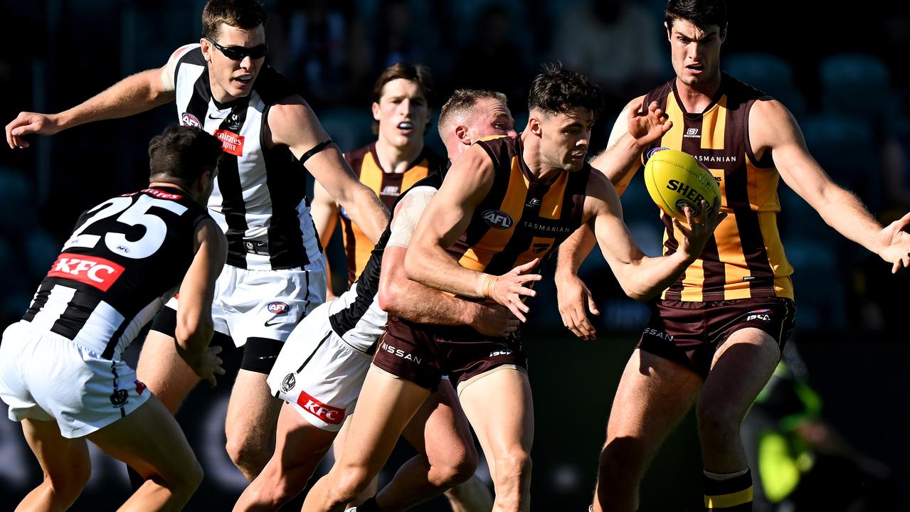 LAUNCESTON, AUSTRALIA – MARCH 02: Conor Nash of the Hawks is tackled during the AFL practice match between the Hawthorn Hawks and the Collingwood Magpies at University of Tasmania Stadium on March 02, 2023 in Launceston, Australia. (Photo by Steve Bell/Getty Images)