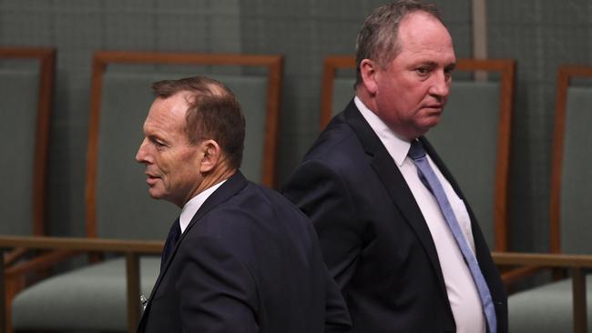 Former prime minister Tony Abbott (left) walks past former deputy prime minister Barnaby Joyce during Question Time at Parliament House in Canberra. The pair withdrew funding for the Australian Animal Welfare Strategy in 2014. PICTURE: AAP IMAGE/LUKAS COCH