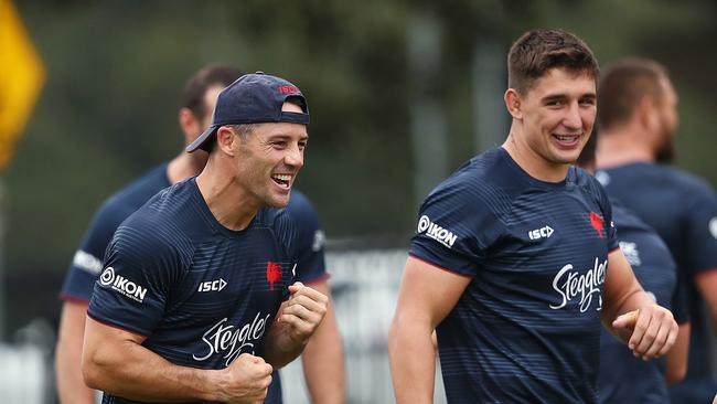 Cooper Cronk and Victor Radley share a laugh at training. Picture: Phil Hillyard