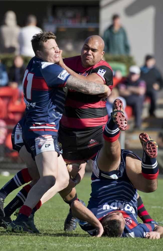 Joe Mua, Valleys dispatches Warwick's Joshua Cruice and Mathew Marshall. TRL grand final, Valleys vs Warwick Cowboys. Sunday, 8th Sep, 2019.