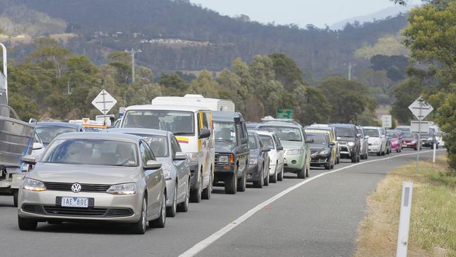 Traffic lines up along the Tasman Highway near the Hobart airport roundabout.