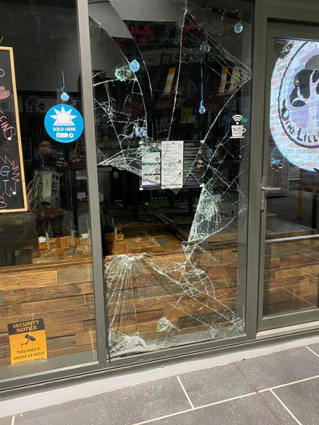 Broken window from a break-in on Wednesday night at One Little Tree cafe.