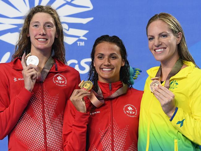 Silver medallist Taylor Ruck of Canada, gold medallist Kylie Masse of Canada and bronze medallist Emily Seebohm of Australia pose during the medal ceremony for the Women's 200m Backstroke Final. Picture: Quinn Rooney/Getty Images