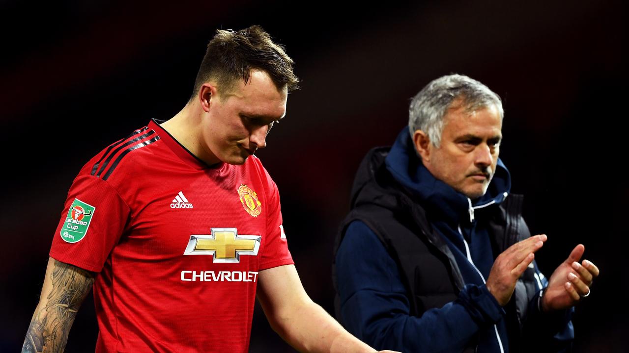 Phil Jones looks dejected after missing his team's eighth penalty against Derby County.