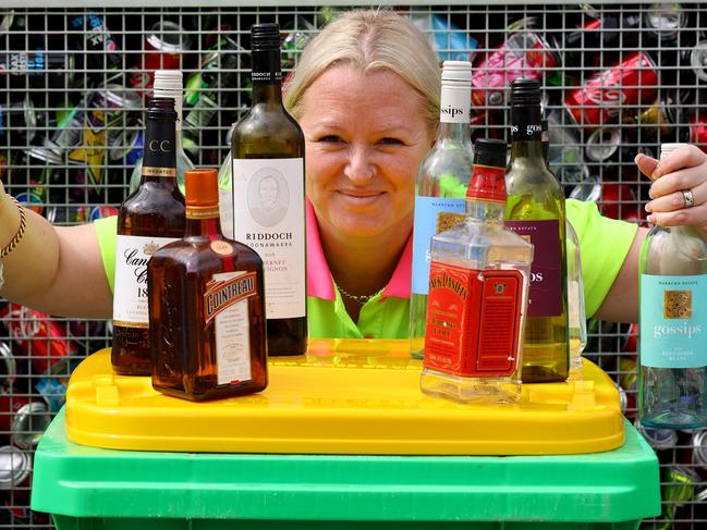 ADELAIDE, AUSTRALIA - NewsWire Photos OCTOBER 1 2021: AAA Recycling manager Krystie Paltridge with worker Jay Couzen sorting expansion of the state's container deposit scheme, to include wine bottles, plain milk, fruit juice bottles and liquor bottles. Picture: NCA NewsWire / Kelly Barnes