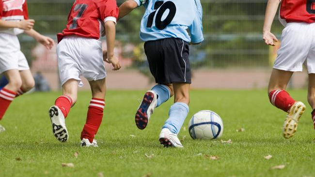 Detail of a soccer game with four players in action