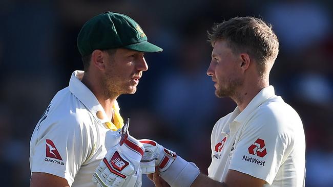 England captain Joe Root (right) gets up close and personal with Australian paceman James Pattinson yesterday. Picture: Getty Images