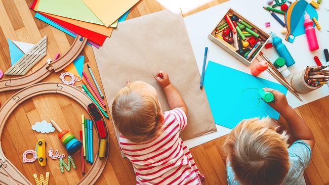 Kids draw and make crafts. Children with educational toys and school supplies for creativity. Background for preschool and kindergarten or art classes. Boy and girl play at home or daycare Picture: Istock