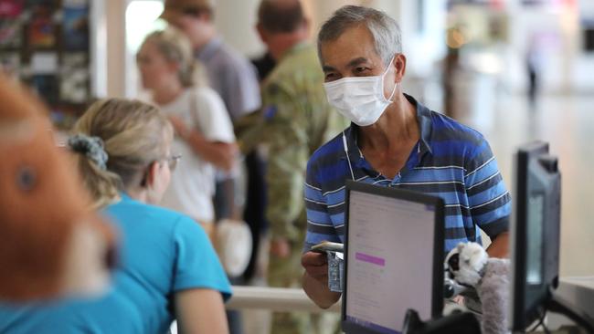 Passengers from Shanghai arrive at Brisbane International Airport on Thursday. Picture: Peter Wallis