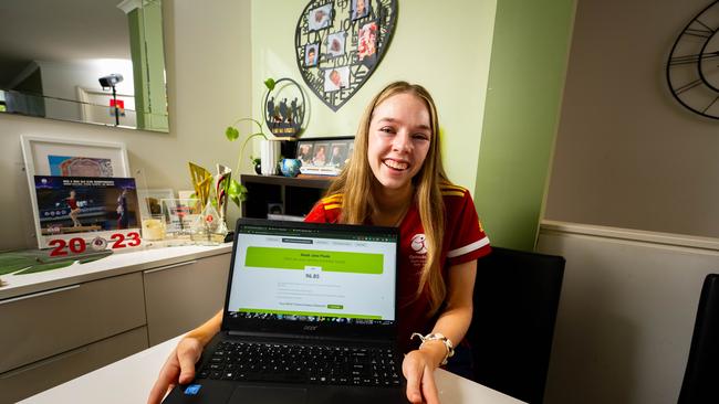 Aleah Poole, 17, a top 40 Year 12 at St Columba College, opening her final Year 12 results in front of compute. Picture: Morgan Sette