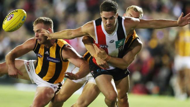 Tom Mitchell crashes a pack in his return. Picture: Michael Klein