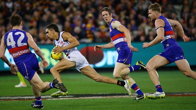 Charlie Cameron is too quick for Liam Picken, Robert Murphy and Jake Stringer. Picture: Colleen Petch.