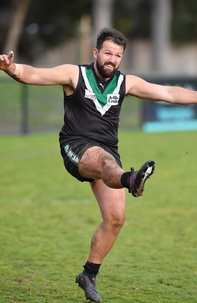 Jack Purcell booting a goal for Donvale.