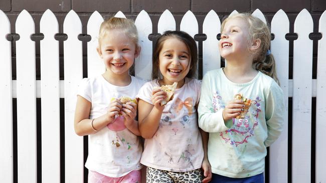 Molly Guy, 5, lsraa Boussi, 4, and Gwen Sanders, 5, at Arncliffe Pre-school taking part in the Munch and Move program today. childcare centres are overcoming the obesity epidemic by teaching kids how to eat healthy food.Picture: Justin Lloyd