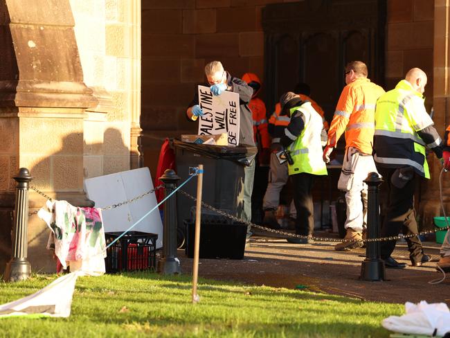 Early in the morning of June 18 at the Sydney University protest camp. Trucks are loaded with leftover camping gear, and rubbish disposed of. Picture: Rohan Kelly