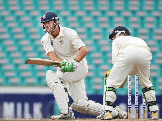 Nick Jewell sweeps for Victoria in the Shield final against NSW in 2008.