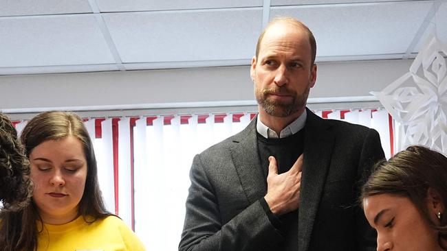 Britain's Prince William, Prince of Wales, talks with children who have been supported by the Child Bereavement UK charity, as they make salt jars, during his visit to the charity's service in Widnes, in northwest England on February 5, 2025. (Photo by Aaron Chown / POOL / AFP)