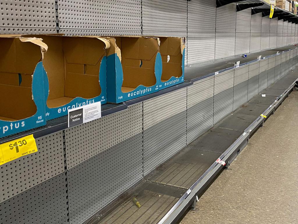 Shelves usually stocked with toilet rolls are seen empty in a supermarket following panic buying in Sydney last week. Picture: Saeed Khan/AFP.