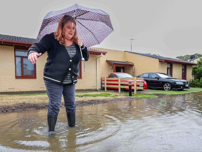 NEWS ADVWEATHER- Denise Palmer of Semaphore Park complaining about the water deluge outside the front of her property.Image/Russell Millard Photography