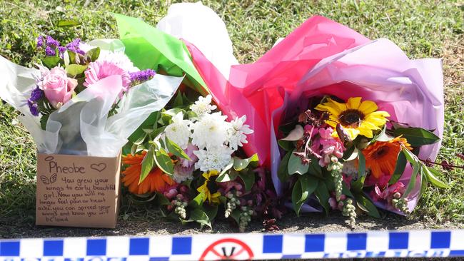 Floral tributes outside Pheobe’s Gin Gin house after remains were found by police searching for her. Picture: Liam Kidston