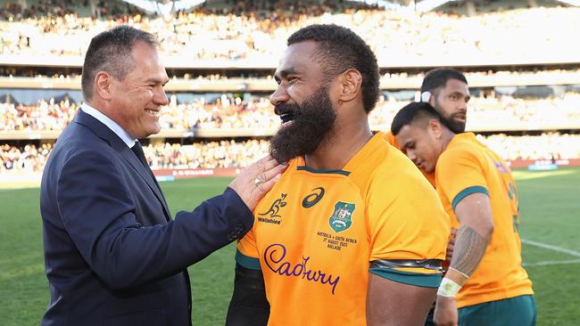 Wallabies head coach Dave Rennie embraces Marika Koroibete.