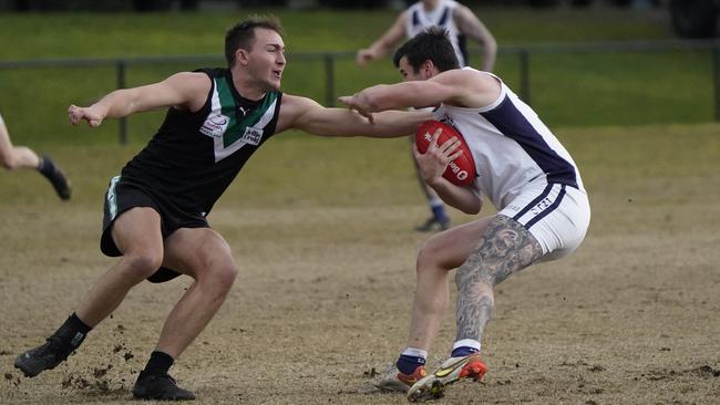 EFL: Donvale’s Josh Jordaan tries to stop Darcy Fritsch of Coldstream. Picture: Valeriu Campan