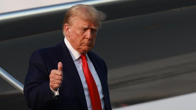 Former U.S. President Donald Trump gives a thumbs up as he arrives at Atlanta Hartsfield-Jackson International Airport on August 24, 2023 in Atlanta, Georgia. Photo by JOE RAEDLE / GETTY IMAGES NORTH AMERICA / Getty Images via AFP