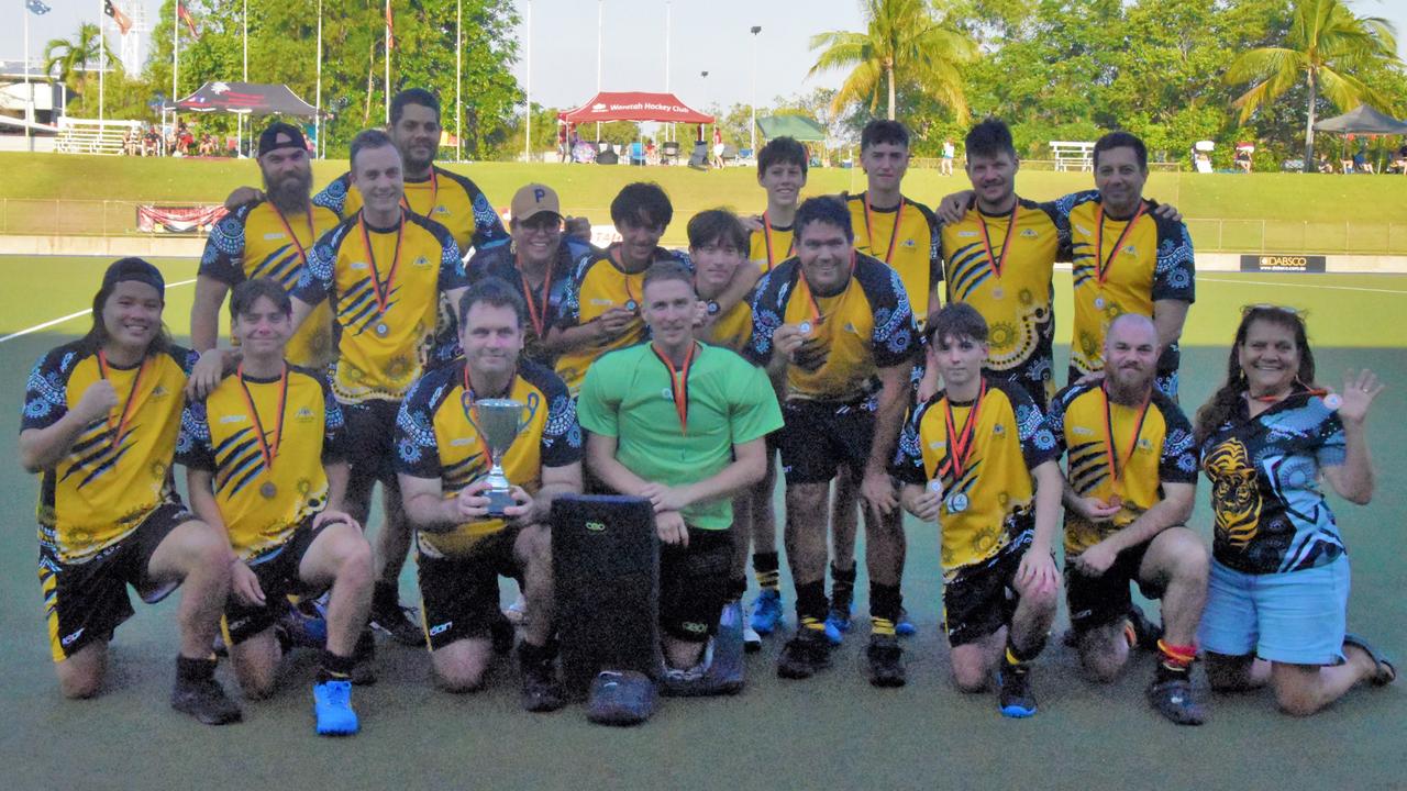 The Tigers Men's B-grade side celebrating their DHL23 premiership victory.