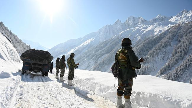 Indian army soldiers walk along a road near Zojila mountain pass that connects Srinagar to the union territory of Ladakh, bordering China in, 2021. India said on October 21, 2024, that it had struck an agreement with neighbour China for military patrols in highly contested border zones, stalled since their rival armies clashed in 2020. Picture: AFP