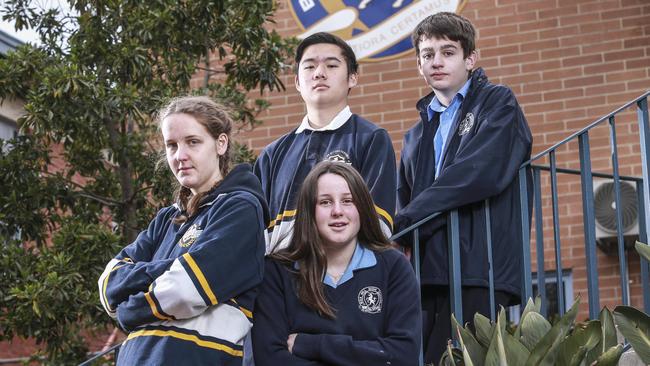 Box Hill High School, with students Ellen Martin, Audrey Martin, Jason Zhou and Flynn Gosby, has hit out at an enrolment cap. Picture: Wayne Taylor