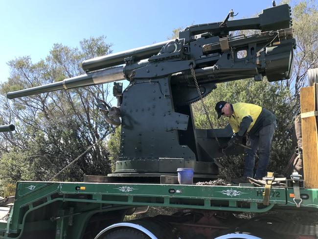 Haulier Karl Rhodes securing a static 3.7-inch anti-aircraft gun on his truck at North Fort late last year