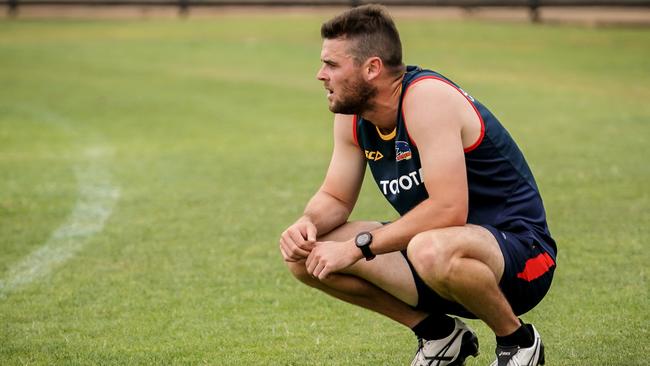 Adelaide midfielder Brad Crouch breathing heavily after a running effort at pre-season training on Monday. Picture: Mike Burton (AAP).