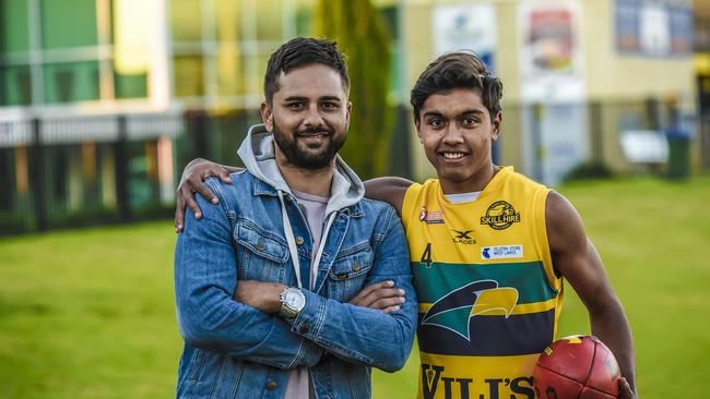 Peter and Trent Burgoyne, wearing his Woodville-West Torrens gear, last year. Picture: AAP/Roy Van Der Vegt