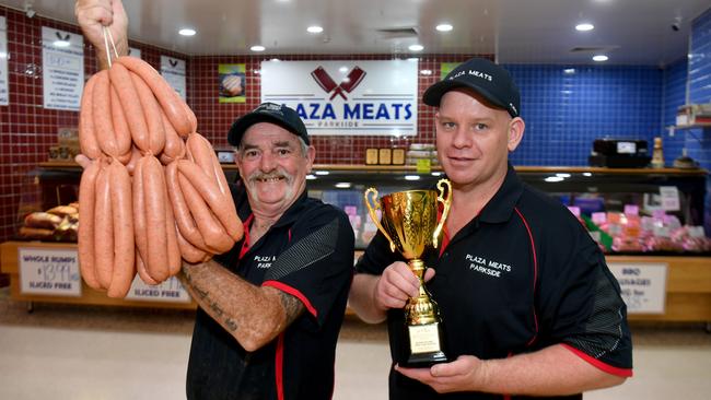 Graeme James and Lee Reilly with Queensland's best Honey Lamb sausages at Plaza Meats in Kirwan. Picture: Evan Morgan