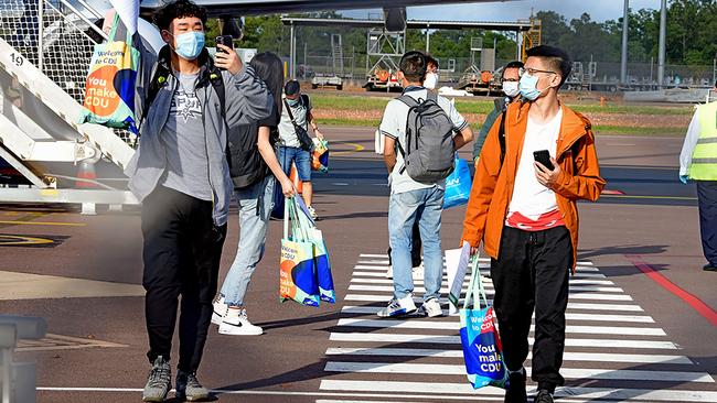 Foreign students disembark from an international flight at Darwin Airport in November. Picture: AFP